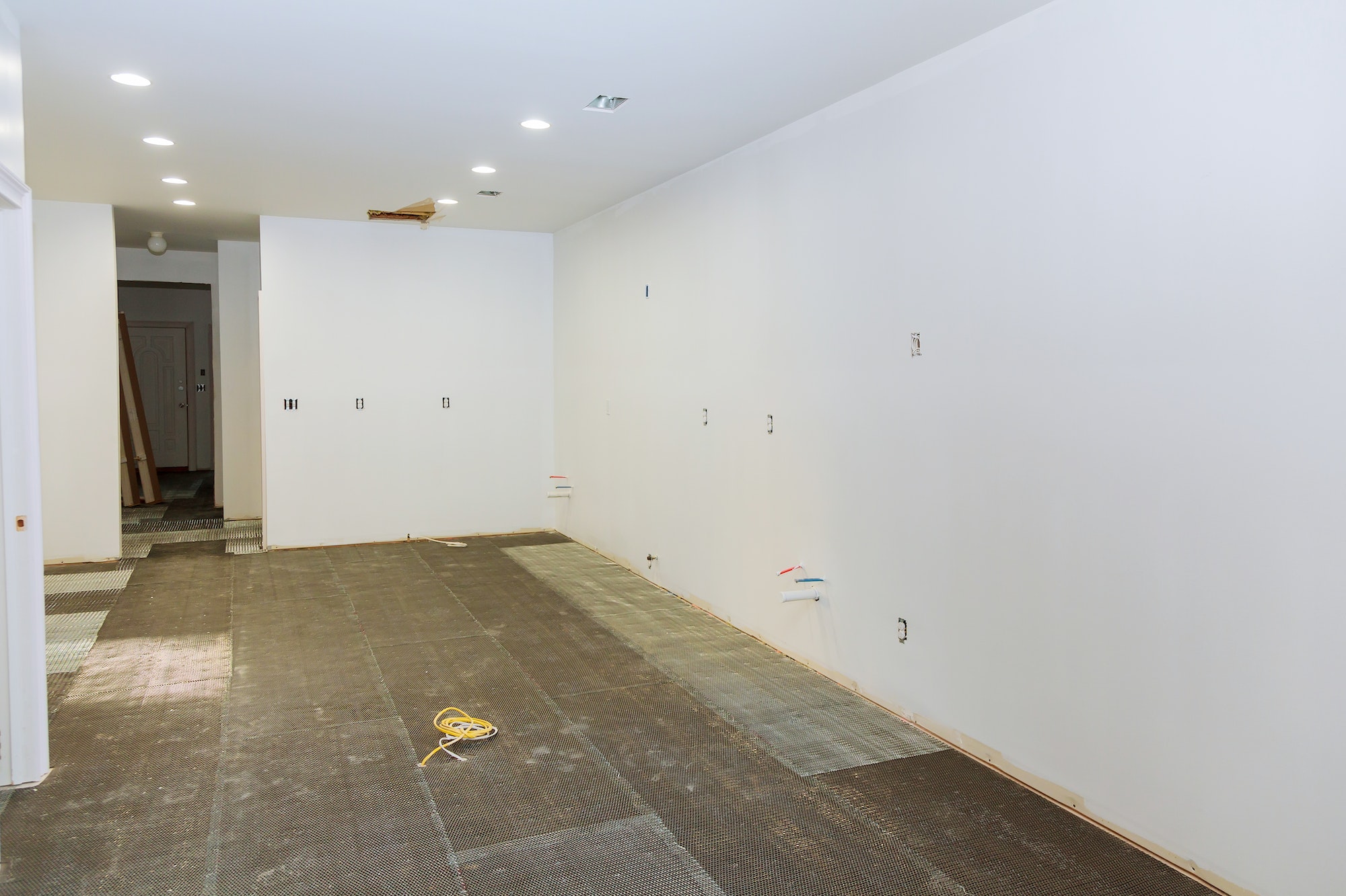 preparation for the installation of tiles in the kitchen in a new home floor